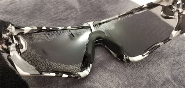 What causes Oakley lenses to peel