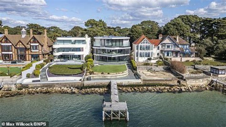 Who owns a house on Sandbanks